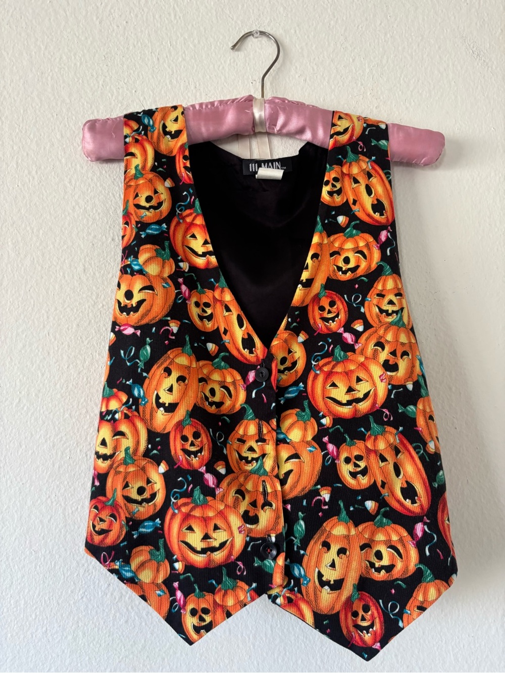 Vintage Paper tag Halloween pumpkin print vest with orange jack-o'-lanterns and